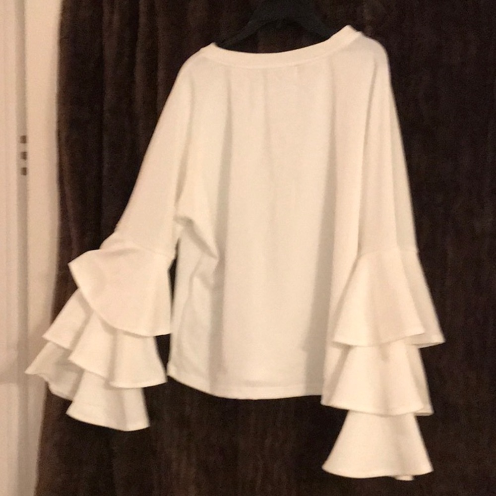 Long sleeved ruffled cuff blouse